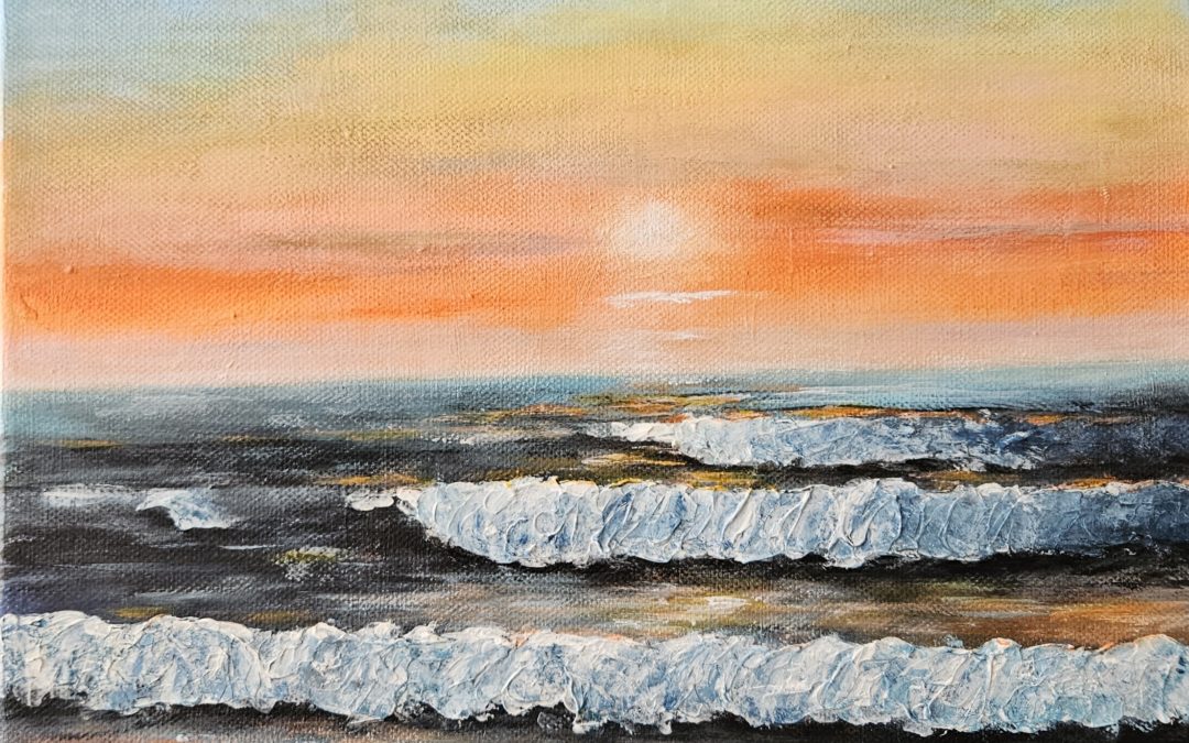 Vagues dans le coucher de soleil